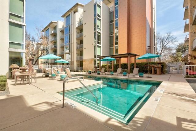 view of swimming pool with a patio area