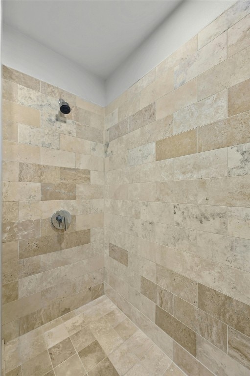 bathroom with tiled shower