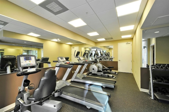 workout area with a paneled ceiling