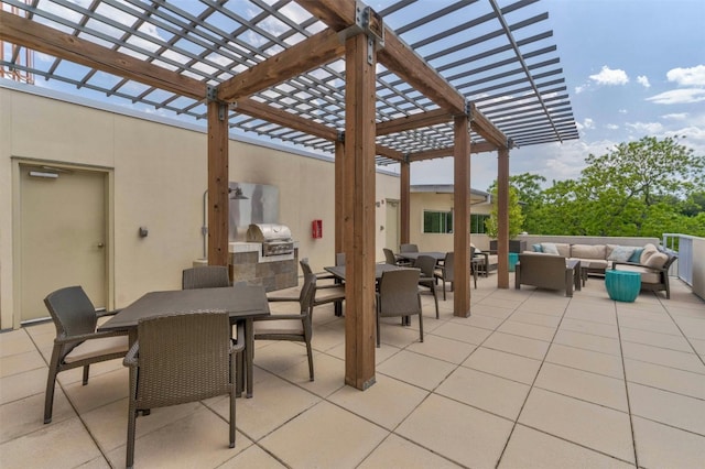 view of patio / terrace with a pergola, an outdoor living space, exterior kitchen, and area for grilling