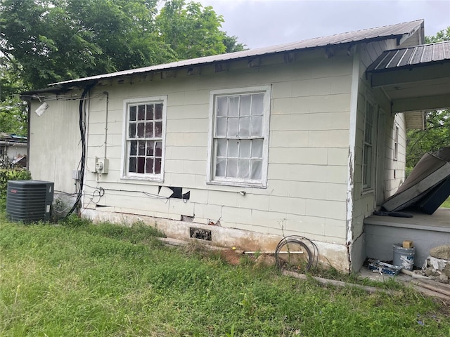 view of side of property featuring central AC unit