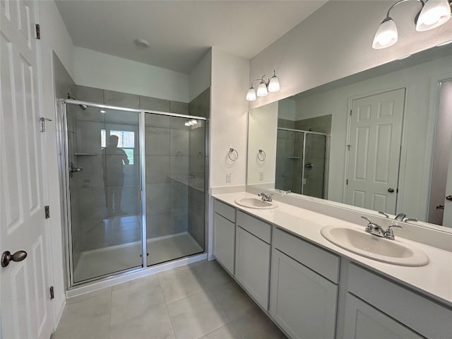 bathroom with vanity, walk in shower, and tile patterned floors