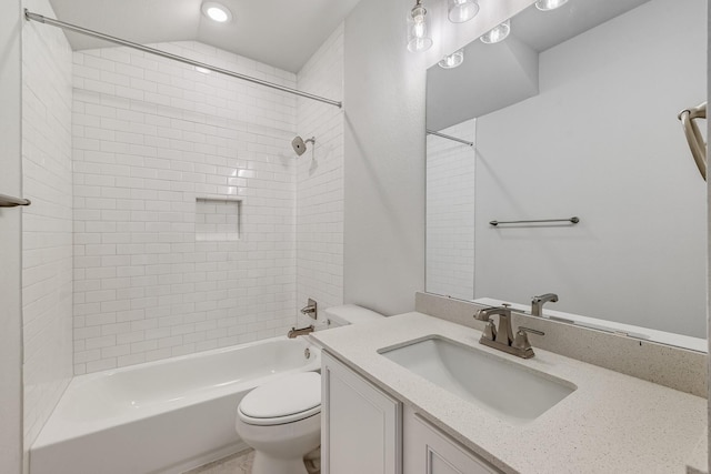 full bathroom with toilet, vanity, and tiled shower / bath combo