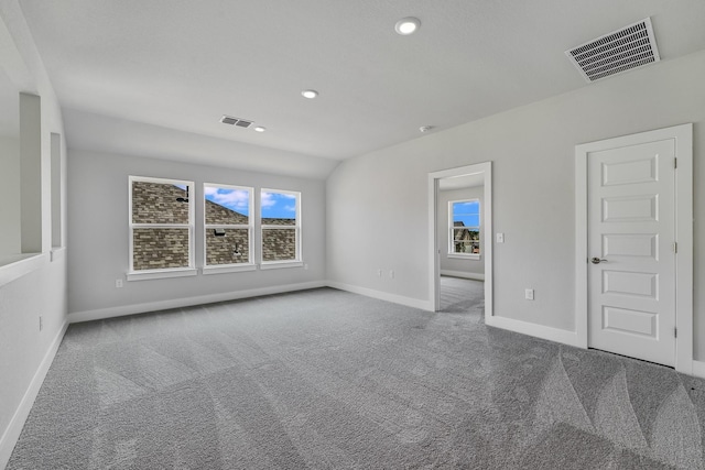 spare room with carpet floors and a healthy amount of sunlight