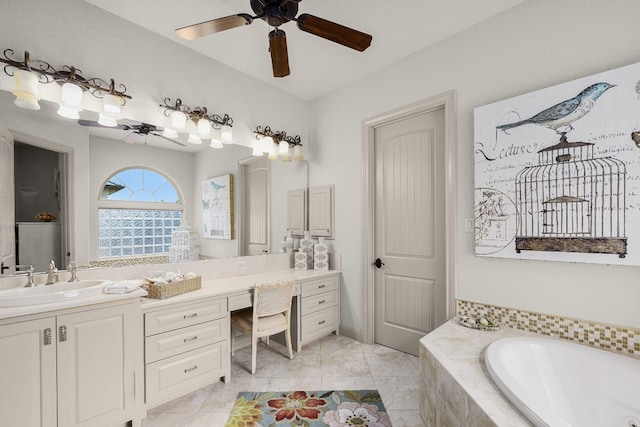 bathroom featuring tiled bath, ceiling fan, tile patterned flooring, and vanity