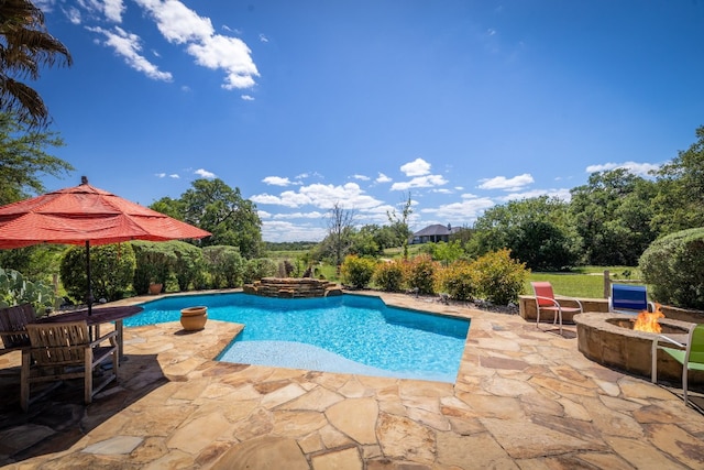 pool featuring a patio area and an outdoor fire pit