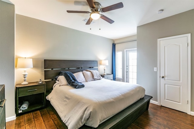 bedroom featuring dark hardwood / wood-style flooring and ceiling fan