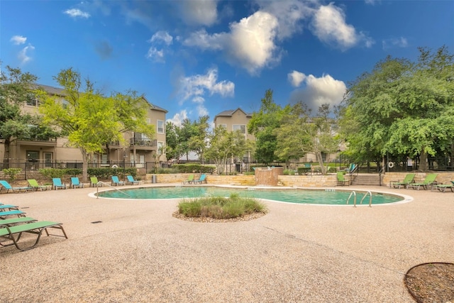 view of swimming pool with a patio area