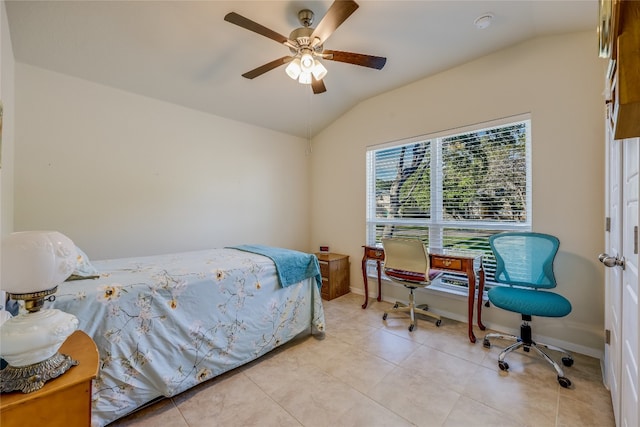 tiled bedroom featuring ceiling fan and vaulted ceiling