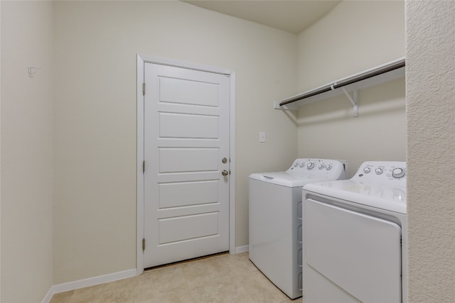 laundry area with washing machine and dryer