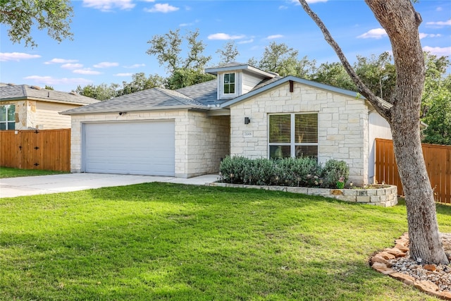 single story home featuring a garage and a front lawn