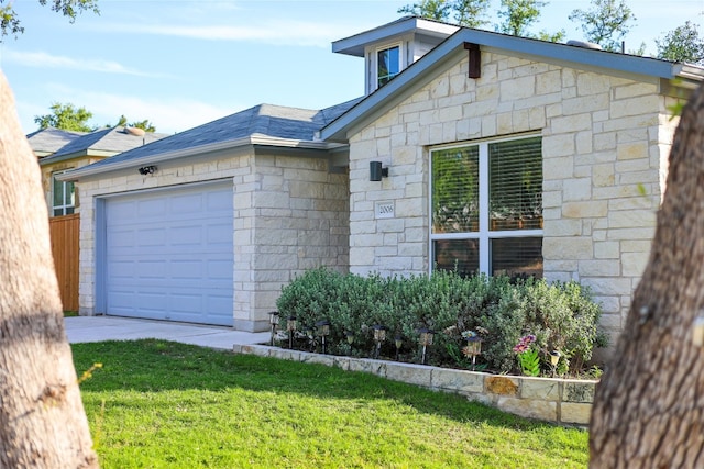 exterior space with a lawn and a garage