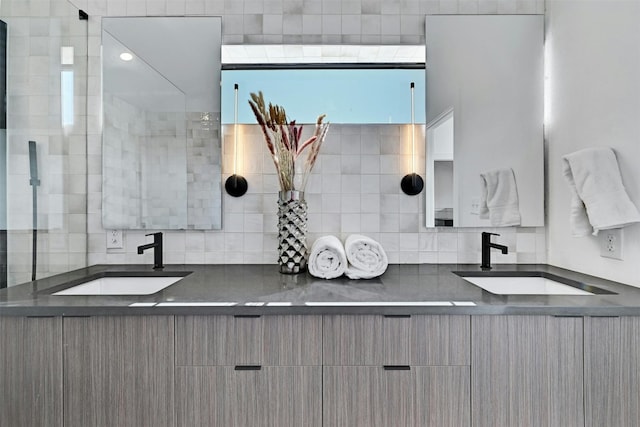 bathroom featuring vanity and backsplash