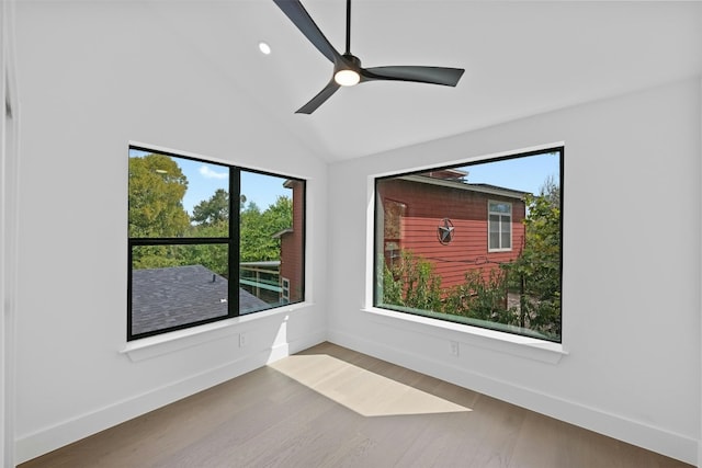 unfurnished room with ceiling fan, vaulted ceiling, and a healthy amount of sunlight