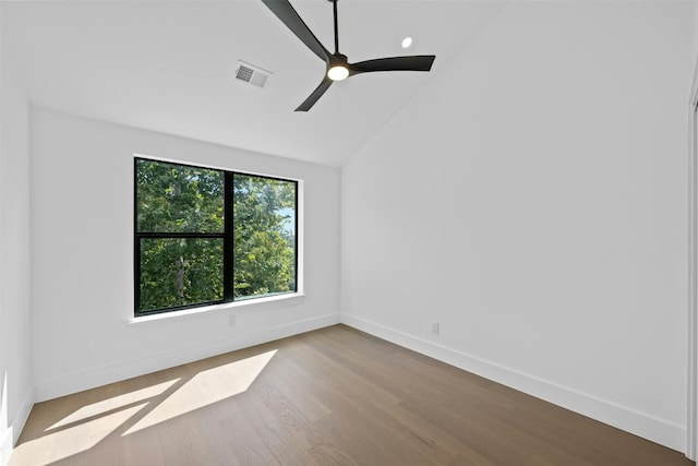 unfurnished room with vaulted ceiling, ceiling fan, and light hardwood / wood-style floors