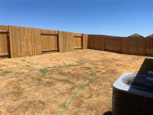 view of yard featuring central AC unit