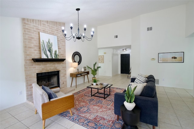 tiled living room featuring a brick fireplace, vaulted ceiling, and an inviting chandelier