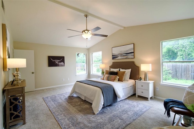 bedroom featuring vaulted ceiling with beams, ceiling fan, and light colored carpet