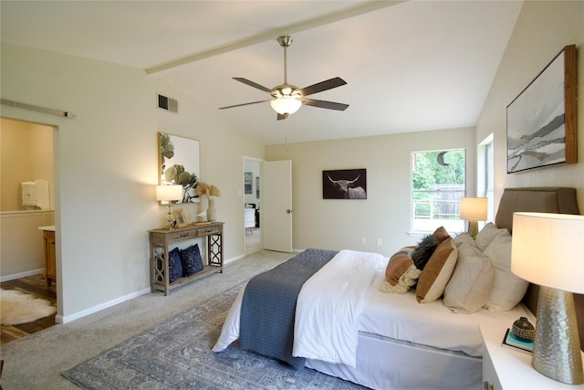 carpeted bedroom featuring vaulted ceiling with beams, ensuite bath, and ceiling fan