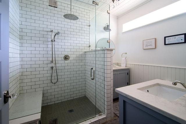 bathroom with vanity and a shower with shower door