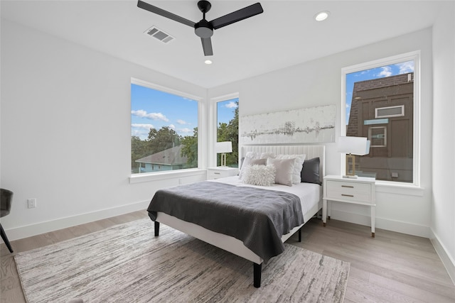 bedroom featuring ceiling fan and light hardwood / wood-style flooring