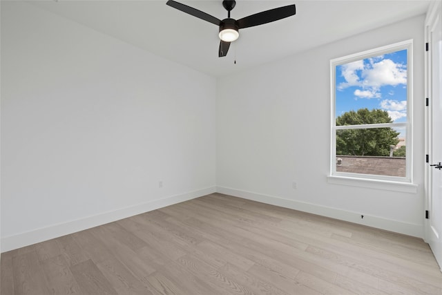 unfurnished room with light wood-type flooring and ceiling fan