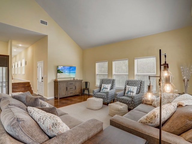 living room featuring high vaulted ceiling and dark hardwood / wood-style flooring