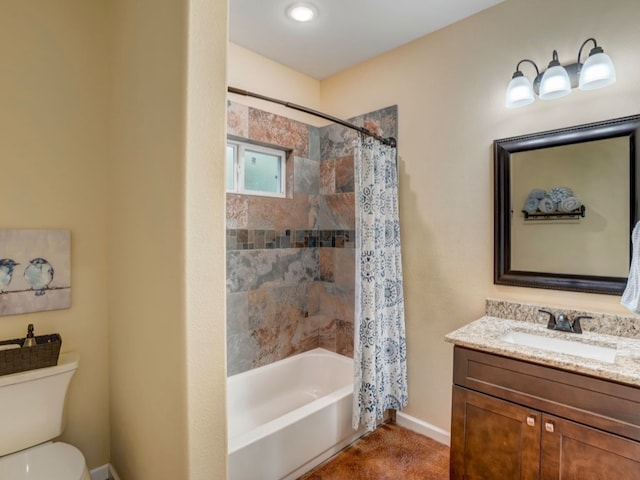 full bathroom with vanity, shower / tub combo, and toilet