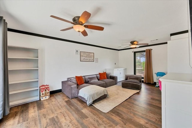 living room featuring hardwood / wood-style floors, ceiling fan, and ornamental molding