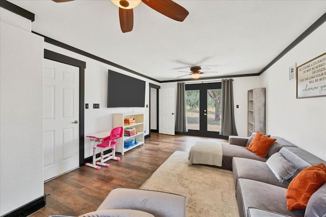 living room featuring dark hardwood / wood-style flooring, crown molding, and french doors