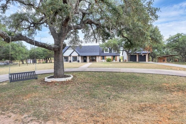 view of front of home featuring a garage and a front lawn