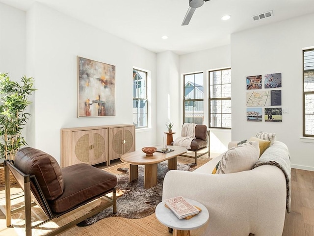 sitting room featuring hardwood / wood-style flooring and ceiling fan