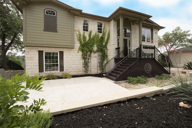 view of front facade with a patio