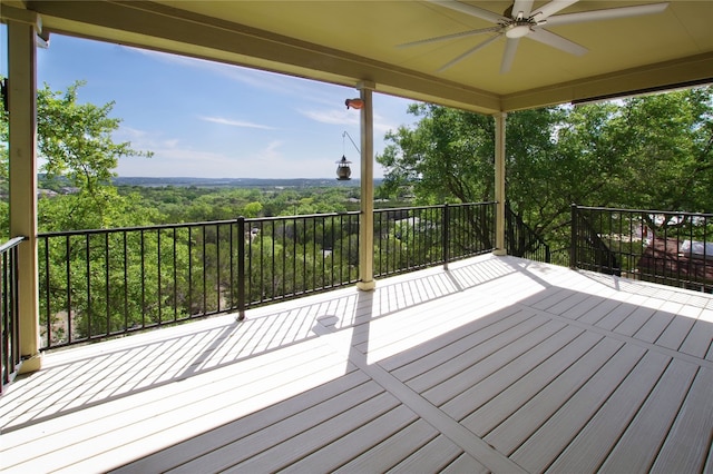 wooden terrace featuring ceiling fan