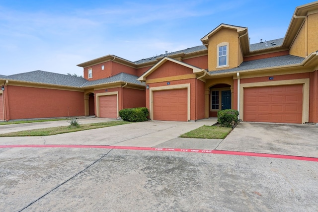 view of front of property with a garage