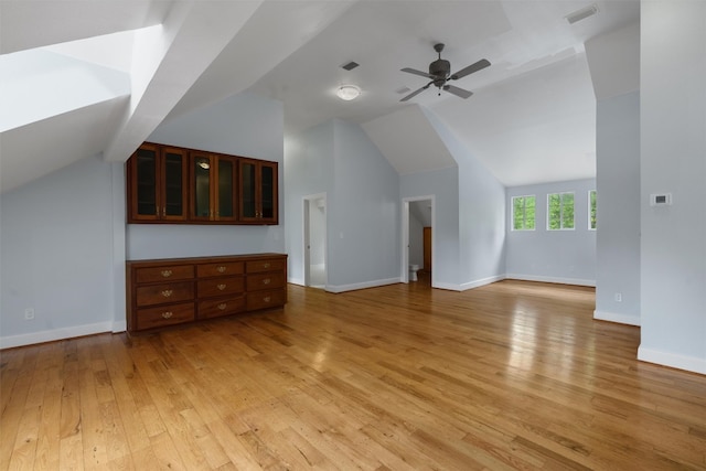 additional living space with light hardwood / wood-style flooring, ceiling fan, and vaulted ceiling