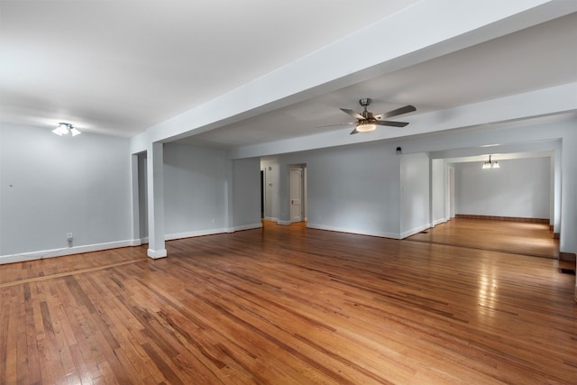 unfurnished room with hardwood / wood-style floors and ceiling fan