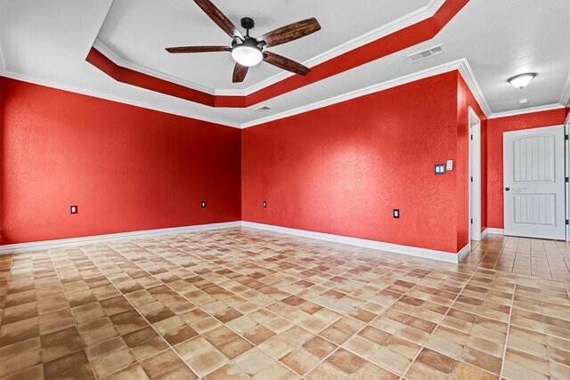 unfurnished room with crown molding, ceiling fan, light tile floors, and a tray ceiling