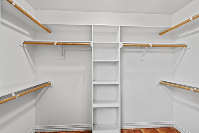 walk in closet featuring wood-type flooring