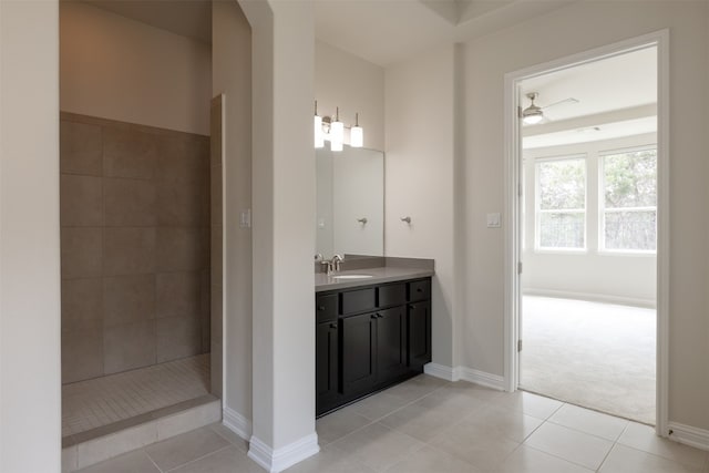 bathroom featuring walk in shower, ceiling fan, tile flooring, and vanity