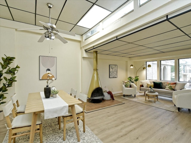 dining room with ceiling fan and hardwood / wood-style floors