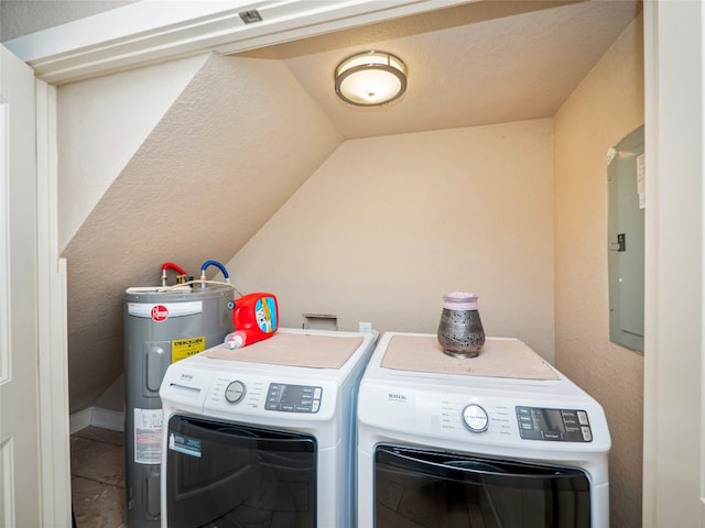 laundry room featuring water heater, washer hookup, and washer and dryer