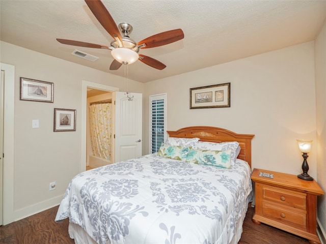 bedroom featuring dark wood-type flooring and ceiling fan