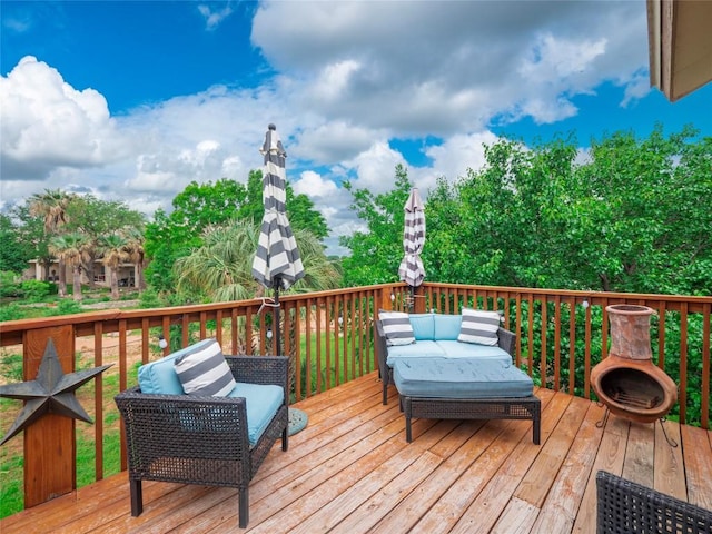 wooden deck with outdoor lounge area