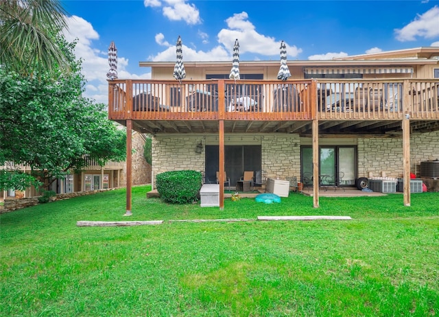 back of house with a deck, a yard, and central AC unit