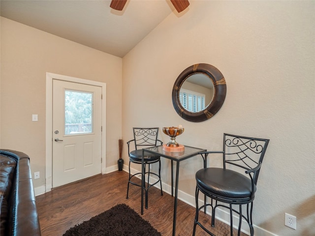 foyer entrance featuring dark hardwood / wood-style floors, ceiling fan, and lofted ceiling