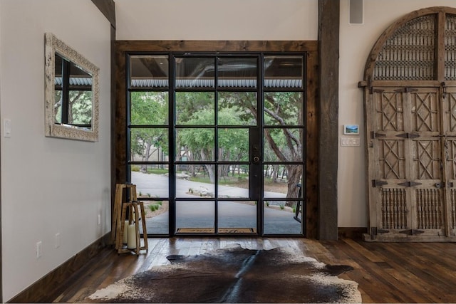 entryway with dark wood-type flooring