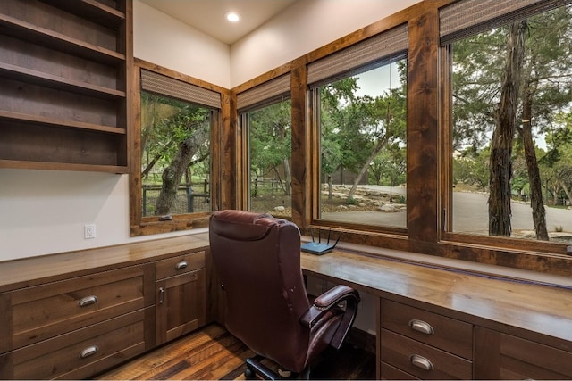 office area featuring built in desk and hardwood / wood-style flooring