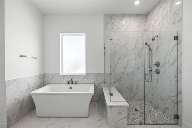 bathroom featuring independent shower and bath and tile walls