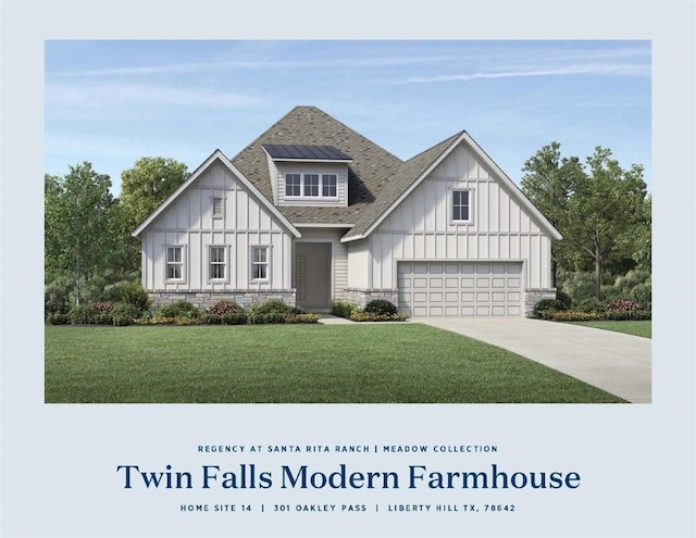 view of front of home featuring a garage and a front lawn